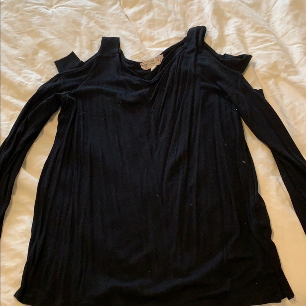 Black shirt. Slits down arm.